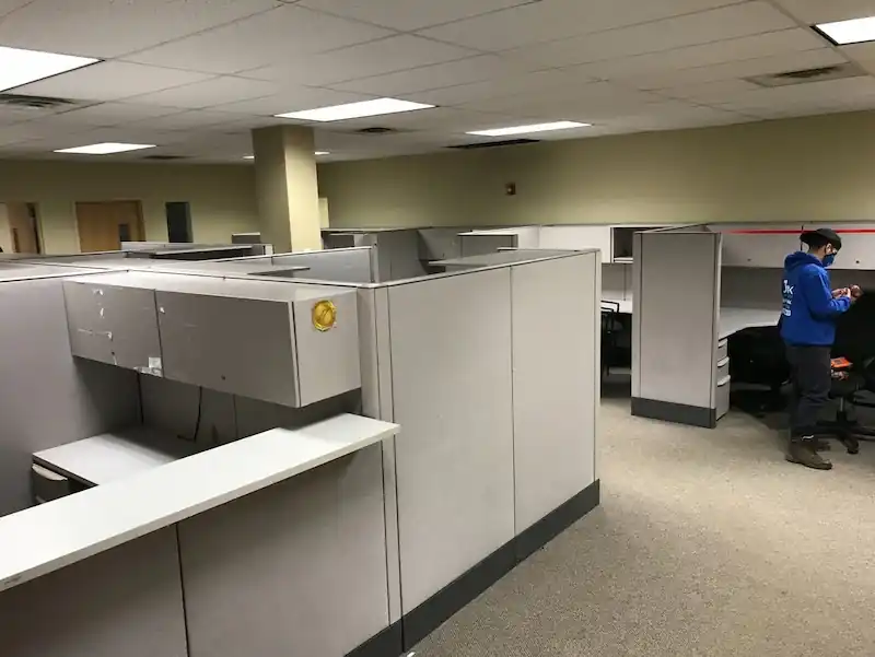 Jersey City office floor with grey cubicles waiting to be removed