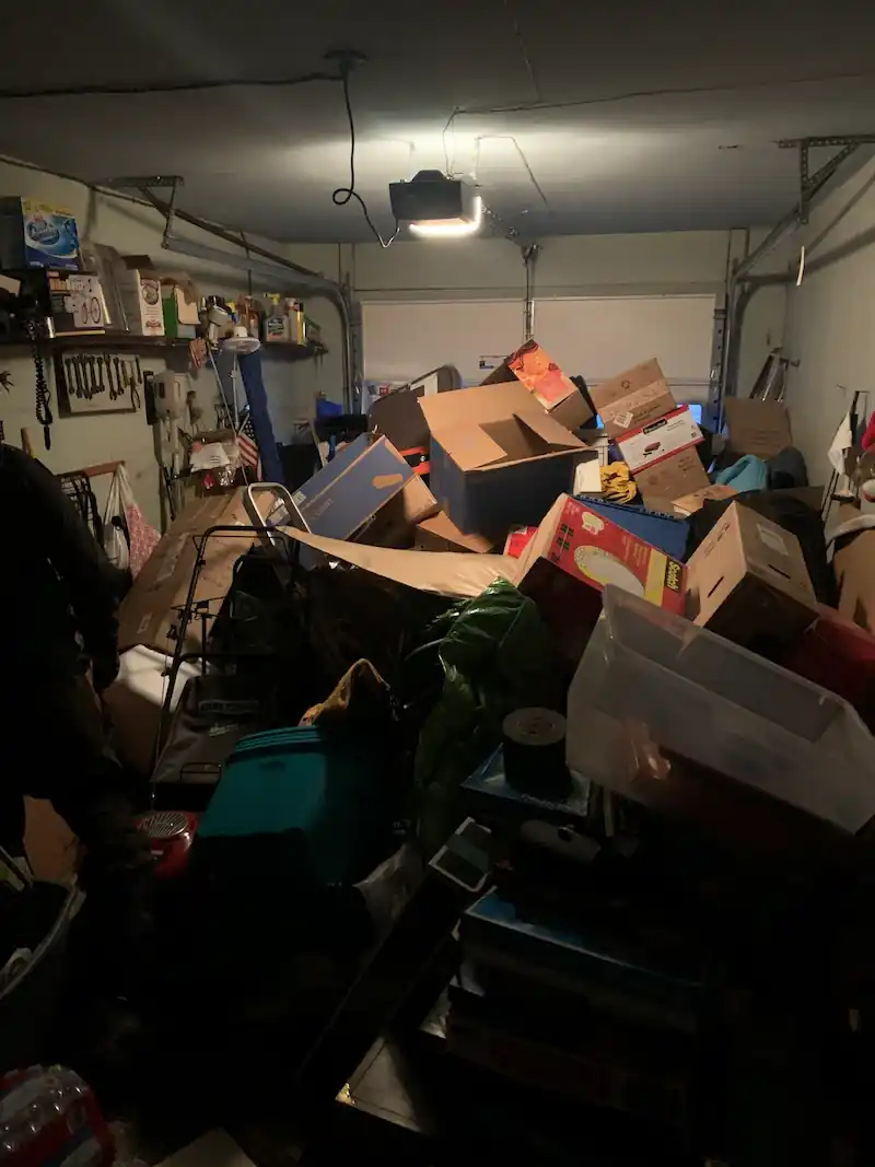 Morristown garage stacked to the ceiling with boxes and bins before the cleanout